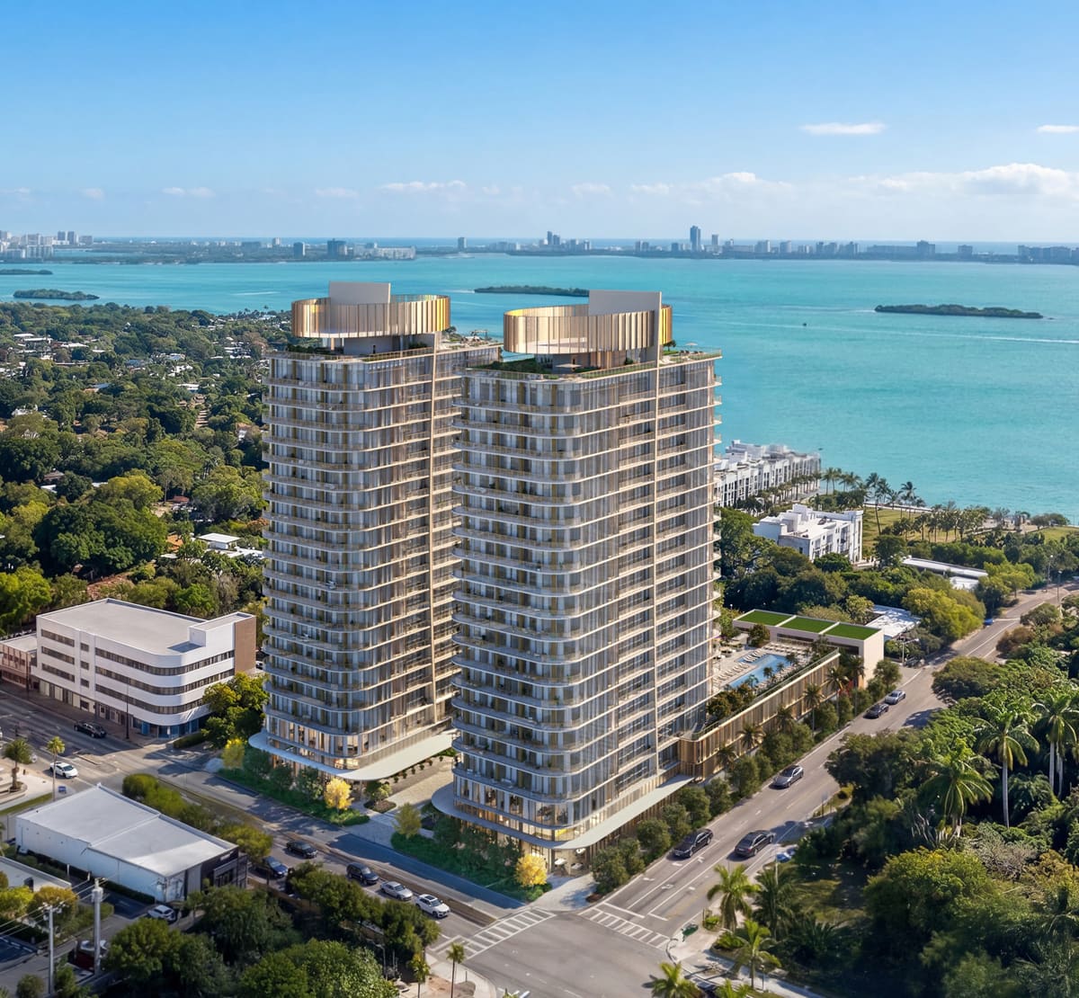 Aerial view of Kempinski Residences Miami Design District showing both towers against Biscayne Bay