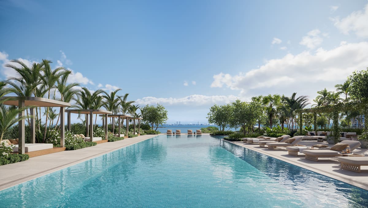 The resort-style pool deck at Kempinski Residences Miami Design District overlooking Biscayne Bay