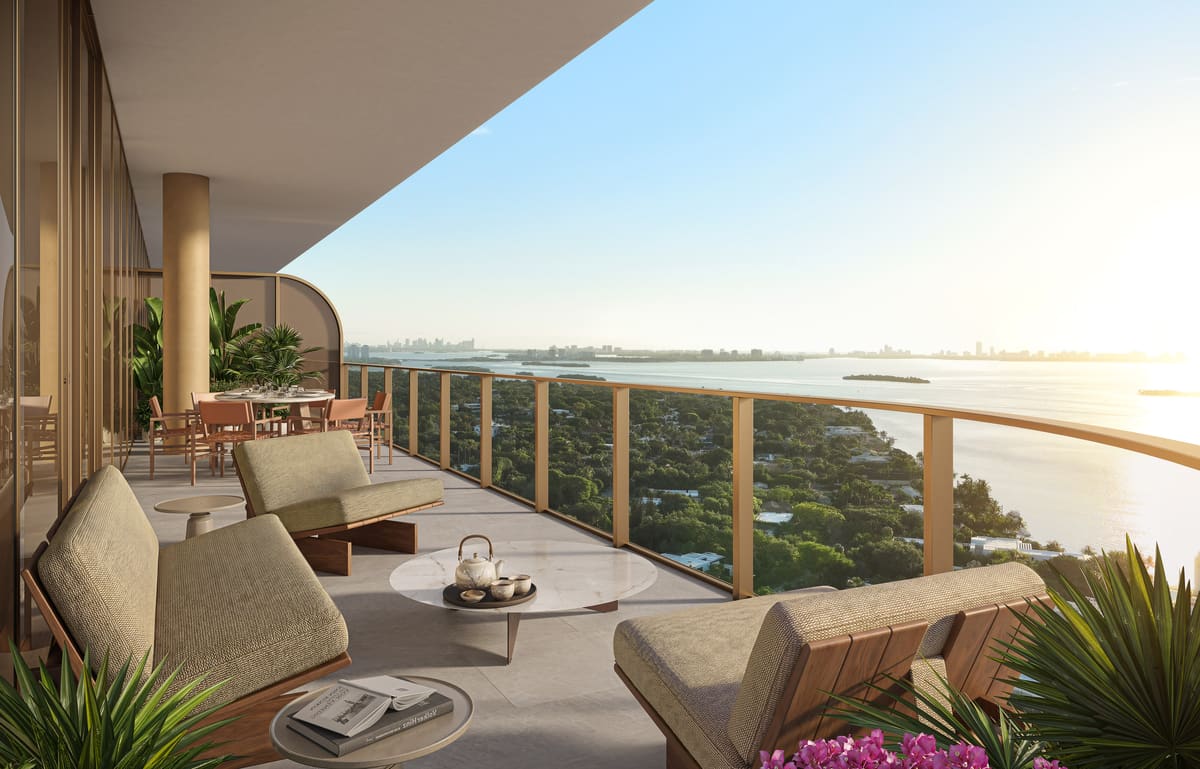 A 10-foot-deep private balcony furnished for outdoor living, overlooking Biscayne Bay