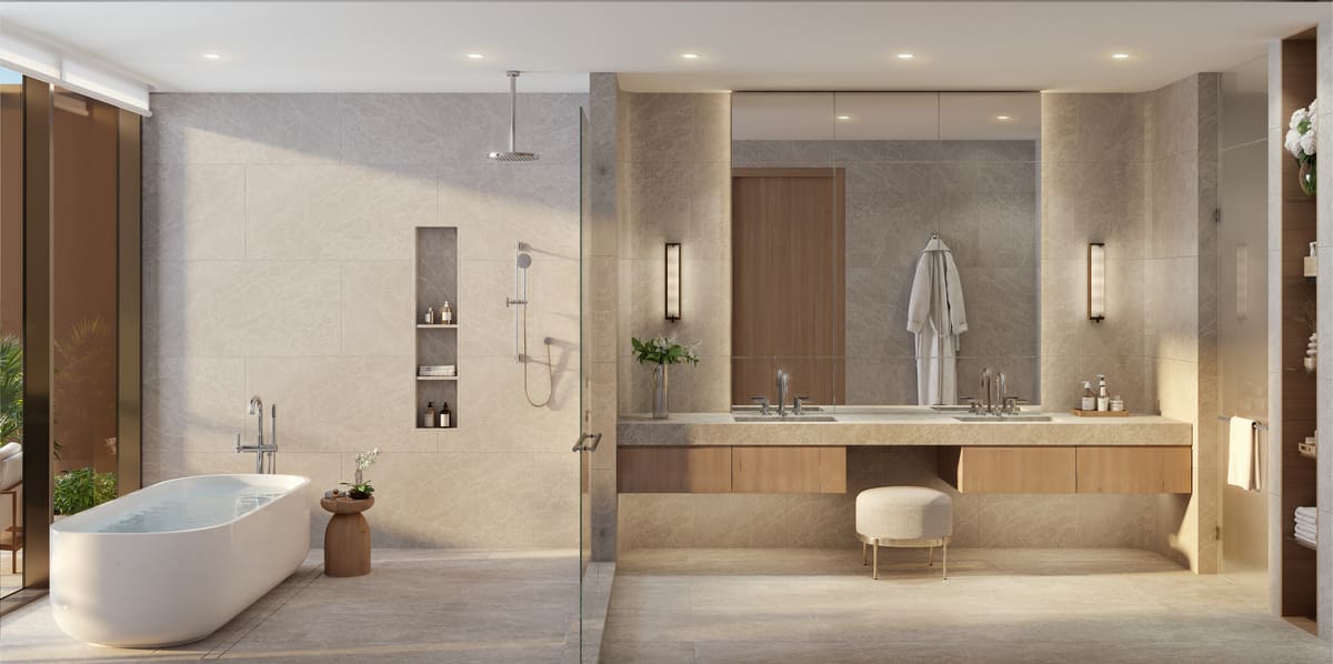 A stone-clad ensuite bathroom with double vanity, walk-in shower and freestanding tub